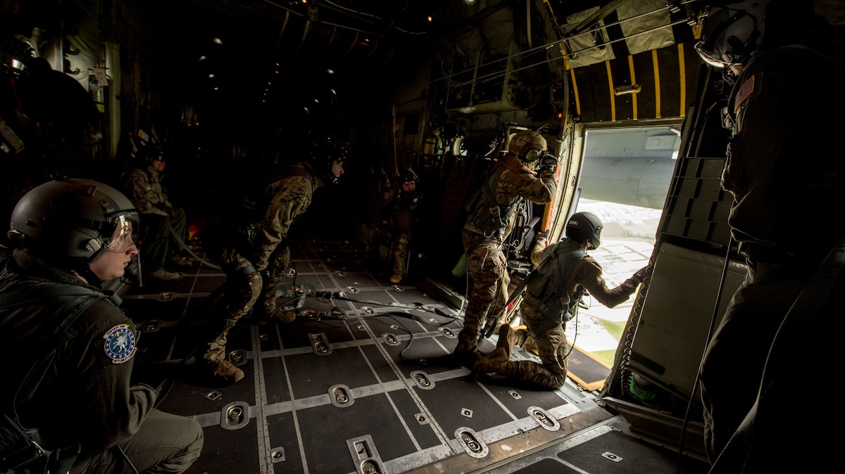 Pararescuemen and combat controllers from the Kentucky Air National Guard’s 123rd Special Tactics Squadron prepare for a jump from a 123rd Airlift Wing C-130 Hercules during the Precision Jumpmaster Course held at Camp Atterbury, Ind., May 13, 2020. The course is an upgrade training class for students who have attended formal jumpmaster training before. (U.S. Air National Guard photo by Phil Speck)