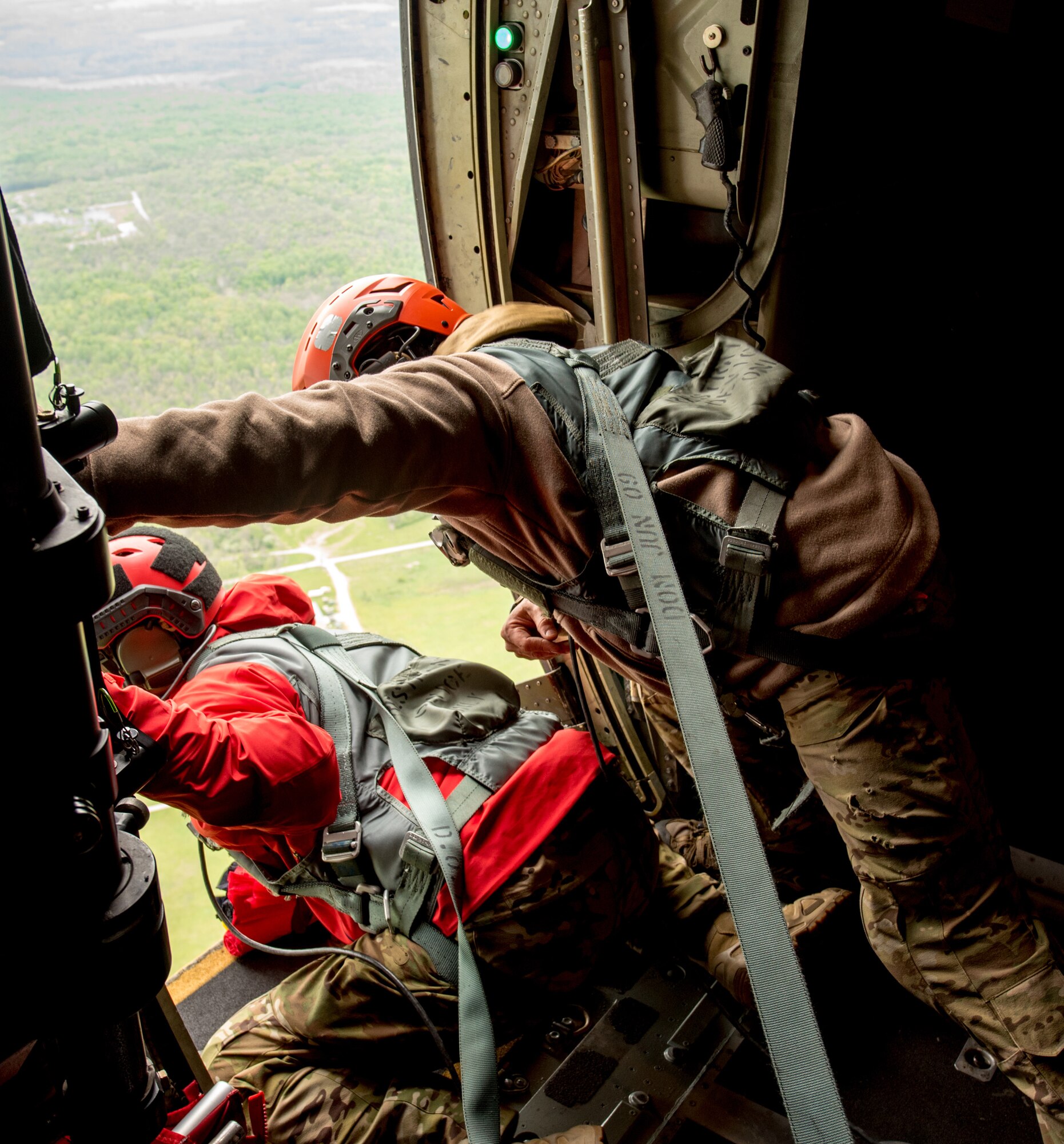 Pararescuemen and combat controllers from the Kentucky Air National Guard’s 123rd Special Tactics Squadron prepare for a jump from a 123rd Airlift Wing C-130 Hercules during the Precision Jumpmaster Course held at Camp Atterbury, Ind., May 13, 2020. The course is an upgrade training class for students who have attended formal jumpmaster training before. (U.S. Air National Guard photo by Phil Speck)