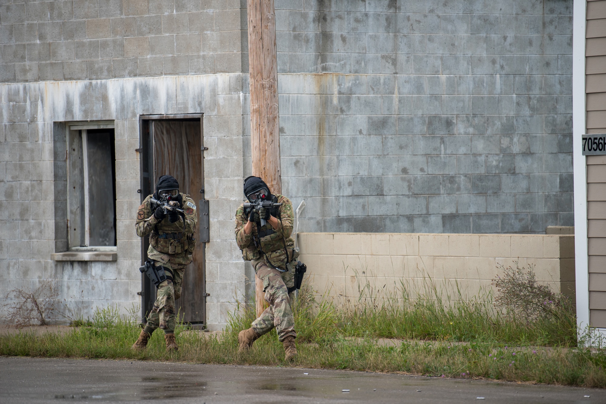 Members of the Kentucky Air National Guard’s 123rd Security Forces Squadron engage in a firefight with opposing forces during training in Alpena, Mich., Aug 20, 2020. The Airmen spent a week at Alpena Combat Readiness Training Center to prepare them for domestic operations and law enforcement assistance. (U.S. Air National Guard photo by Phil Speck)