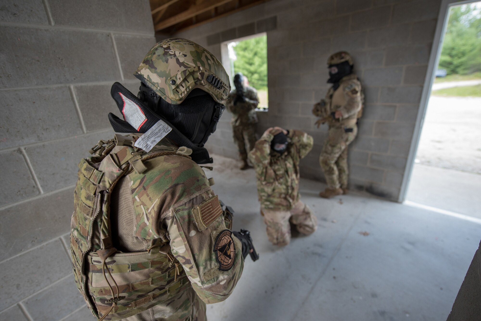 Members of the Kentucky Air National Guard’s 123rd Security Forces Squadron respond during a simulated suicide scenario as part of domestic operations training in Alpena, Mich., Aug 21, 2020. The Airmen spent a week at Alpena Combat Readiness Training Center to prepare them for law enforcement assistance. (U.S. Air National Guard photo by Phil Speck)
