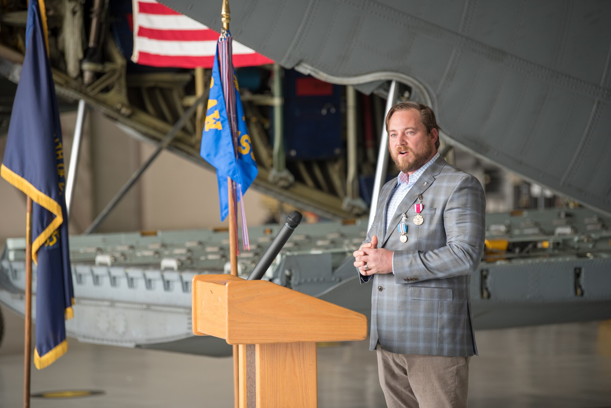 Chief Master Sgt. Larry Burba, chief enlisted manager for the 123rd Force Support Squadron and Explosive Ordinance Disposal flight, speaks to a crowd of family and friends during his retirement ceremony at the Kentucky Air National Guard Base in Louisville, Ky., Oct. 17, 2020. Burba served for more than 21 years in the Kentucky Air National Guard. (U.S. Air National Guard photo by Phil Speck)