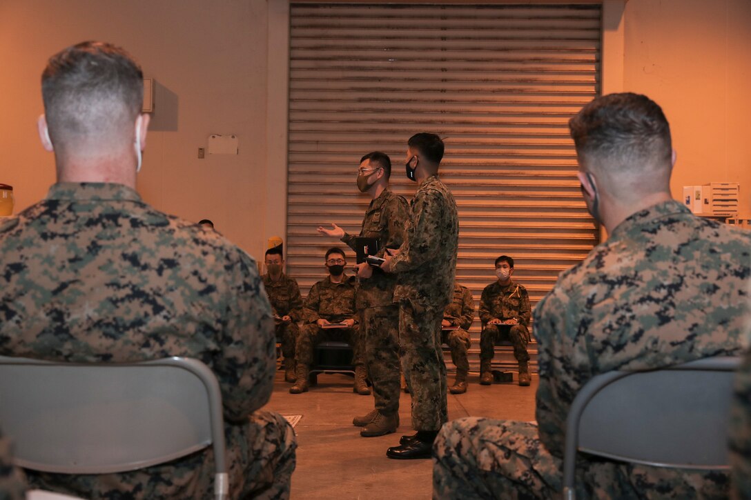Col. Higuchi, commander of the G-3 of the Amphibious Rapid Deployment Brigade of the Japan Ground Self-Defense Force gives opening remarks during a rehearsal of concept drill for Exercise Yama Sakura 79 at Camp Courtney, Okinawa, Japan, Dec. 5, 2020. Exercise Yama Sakura 79 provides opportunity for U.S. Marines and the ARDB of the Japan Ground Self-Defense Force to conduct bilateral training and to share practices, techniques, and experience. The exercise shows the strength of the U.S.-Japan alliance, as well as to promote regional security in the Indo-Pacific Region. The U.S. and Japan are committed to executing bilateral exercises like YS 79 while safeguarding the local public and maintaining readiness at all times despite the pandemic. The 3D MEB is a resilient, ready and relevant force in the Indo-Pacific.  (U.S. Marine Corps photo by Cpl. Hannah Hall)