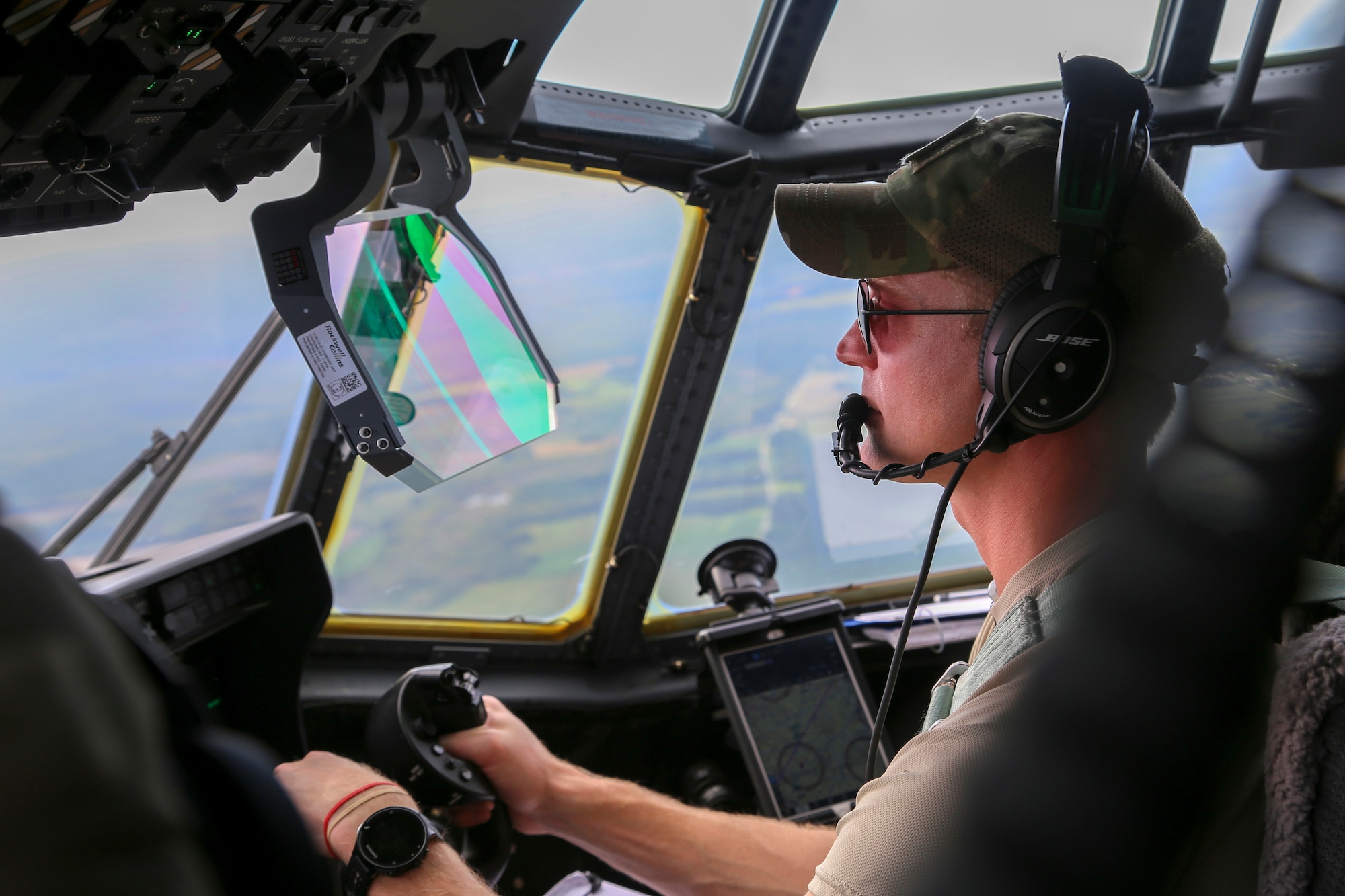 Alaska Air National Guard Capt. Matthew Soukup, a pilot with the 176th Wing’s 211th Rescue Squadron, searches for isolated flood survivors aboard an HC-130J Combat King II aircraft while assisting with hurricane relief operations in North Carolina, Sept. 17, 2018.