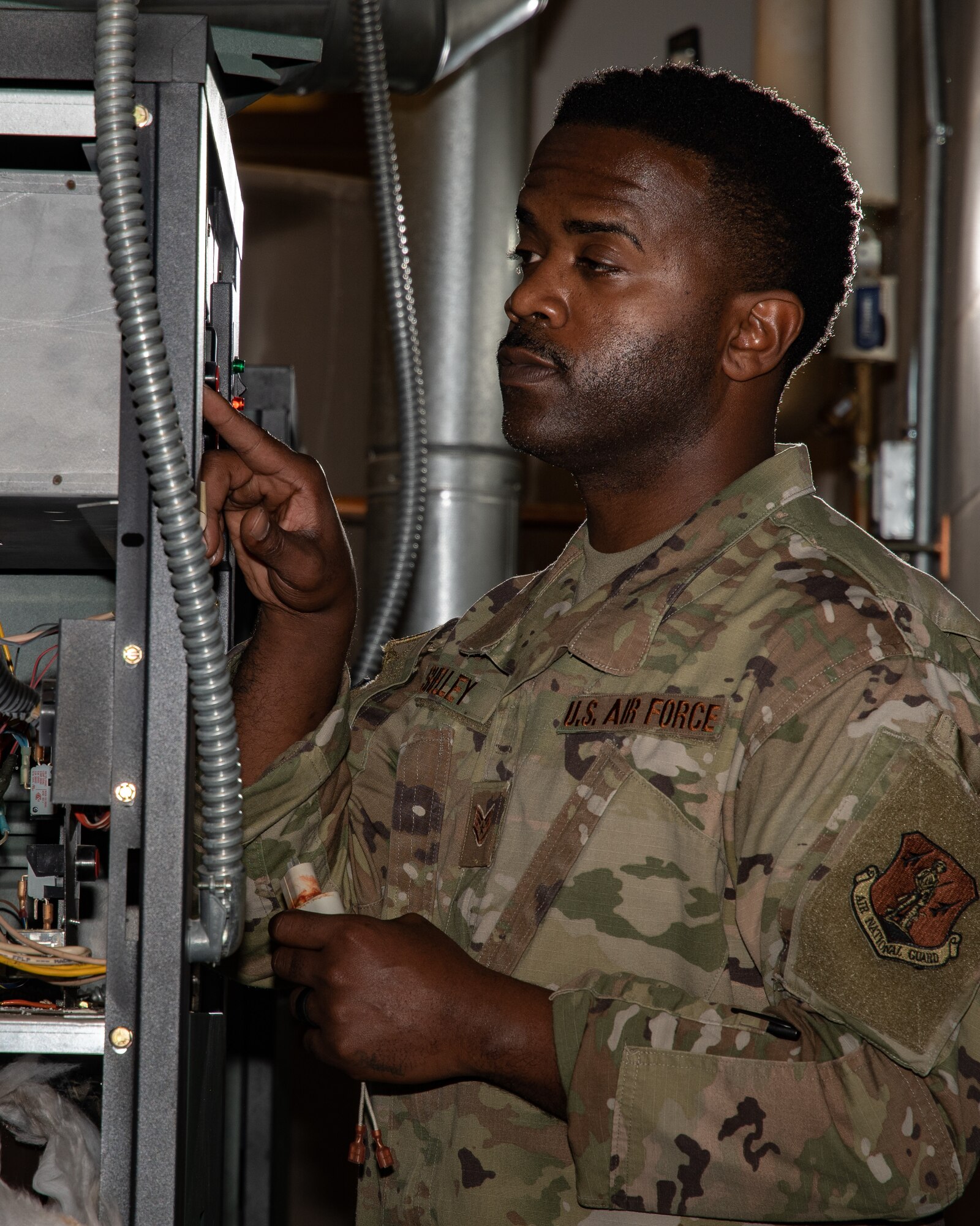 U.S. Air Force Staff Sgt. Travis Shelley, a heating, ventilation, and air conditioning technician with the 116th Civil Engineer Squadron, 116th Air Control Wing, Georgia Air National Guard, performs a periodic inspection on a boiler at Robins Air Force Base, Georgia, Dec. 30, 2020. Shelley was the recipient of the Major General Eugene A. Lupia Award in the Airman category for the Air National Guard in 2020 for superior job performance. (U.S. Air National Guard photo by Senior Master Sgt. Roger Parsons)