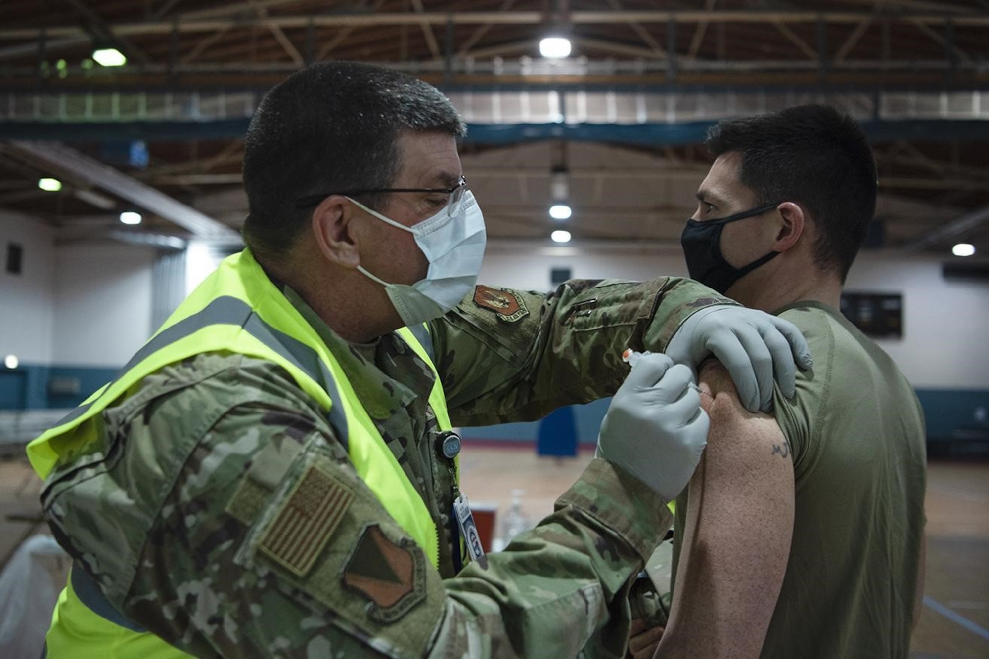 U.S. Air Force Capt. Christopher J. Gresham, 569th U.S. Forces Police Squadron operations officer, receives a COVID-19 vaccination at Ramstein Air Base, Germany, Jan. 4, 2021. Vaccine distribution is anticipated to continue over the next several months through a Defense Department-wide phased vaccination approach. (U.S. Air Force photo by Senior Airman Jennifer Gonzales)