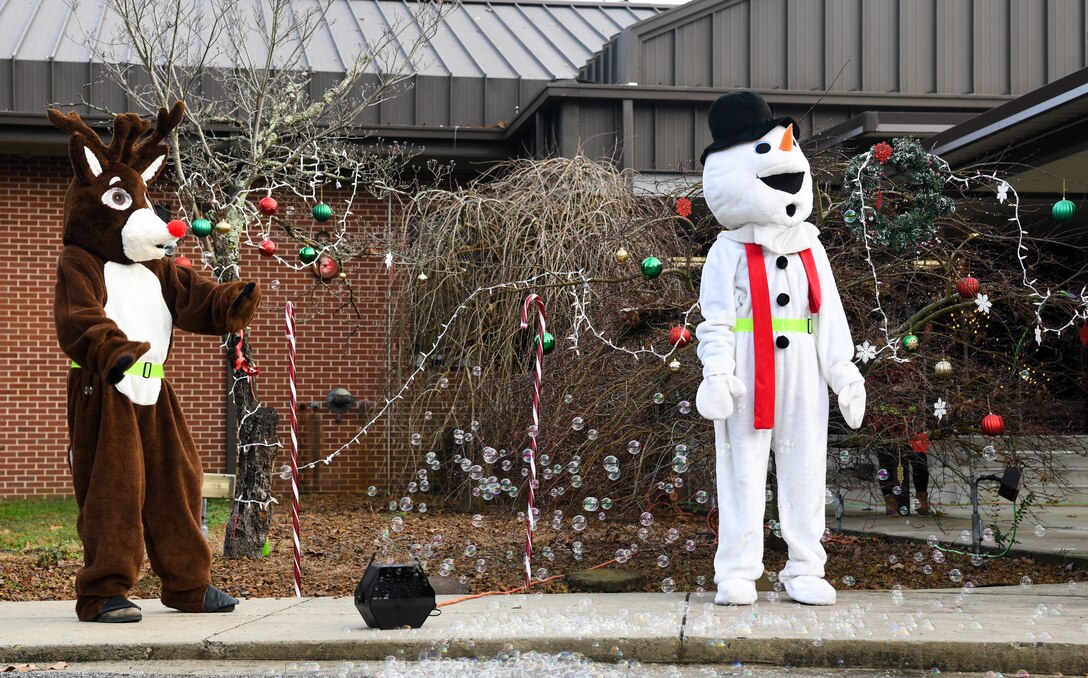 Rudolph dances, Dec. 12, 2020, while helping deliver holiday cheer for attendees of the Children's Candy Cane Caravan at Arnold Air Force Base, Tenn. (U.S. Air Force photo by Jill Pickett)