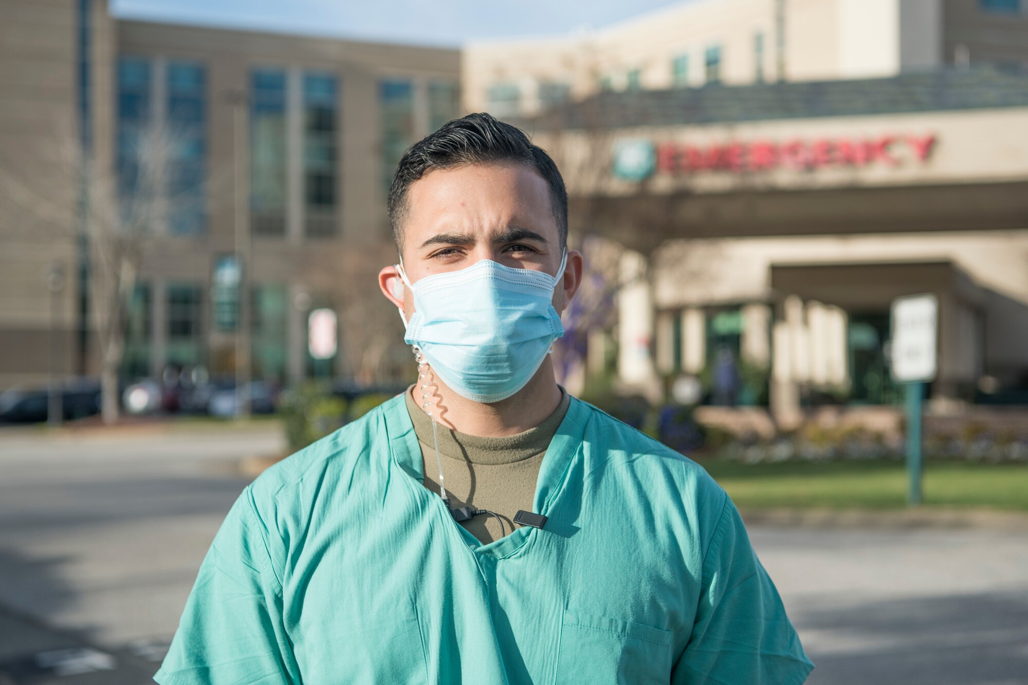 An emergency room technician smiles for a photo