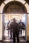 New recruits with Alpha Company, 1st Recruit Training Battalion, stand in formation during receiving at Marine Corps Recruit Depot, San Diego, Dec. 29, 2020.