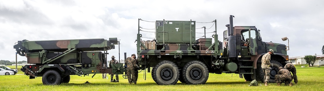 U.S. Marines with 12th Marine Regiment, 3d Marine Division, set up a Ground and Air Task Oriented Radar system at Marine Corps Air Station Futenma, Okinawa, Japan, Aug. 10, 2020. The G/ATOR allows Marines to see further distances and is used to locate enemy weapon systems. Having this capability further enhances the III Marine Expeditionary mission and increases lethality. (U.S. Marine Corps photo by Cpl. Savannah Mesimer)