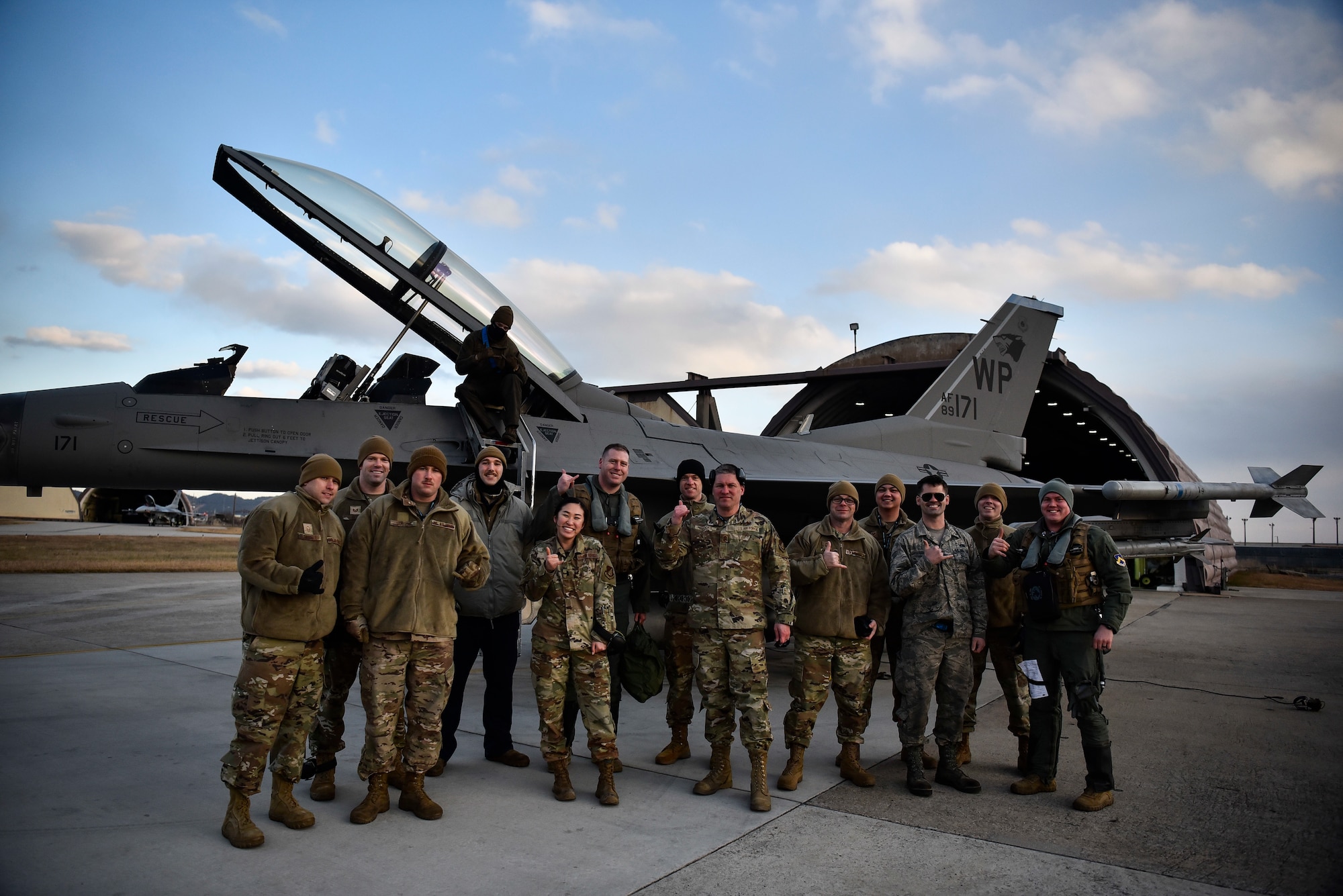 A group of Airmen pose for a photo together.
