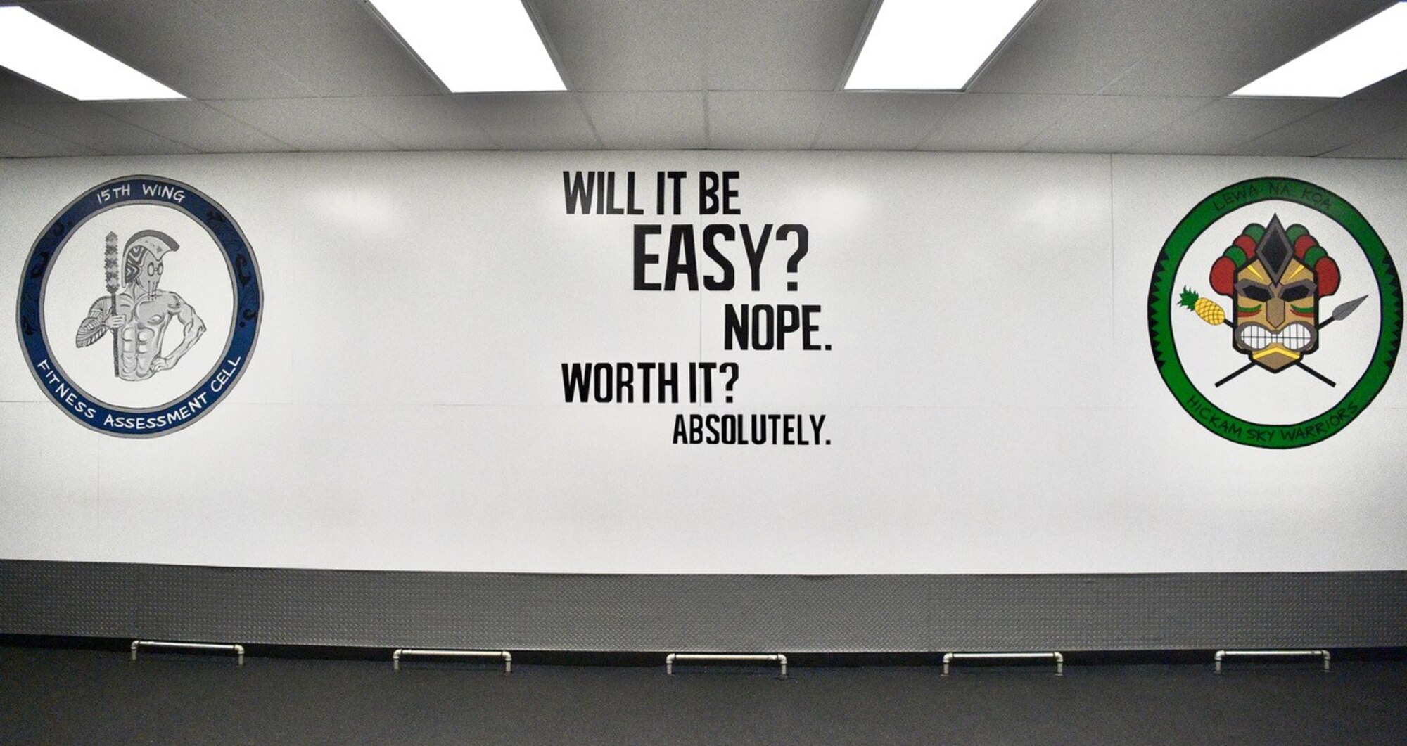 The wall of the Fitness Assessment Cell features a series of new paintings completed by Airman 1st Class Tessa Hanson, 647th Force Support Squadron services journeyman, as part of an effort to help motivate Airmen during their physical fitness assessments at Joint Base Pearl Harbor-Hickam, Hawaii, Dec. 11, 2020. The paintings were completed while the FAC was closed due to COVID-19. (Air Force photo by 2nd Lt Benjamin Aronson)