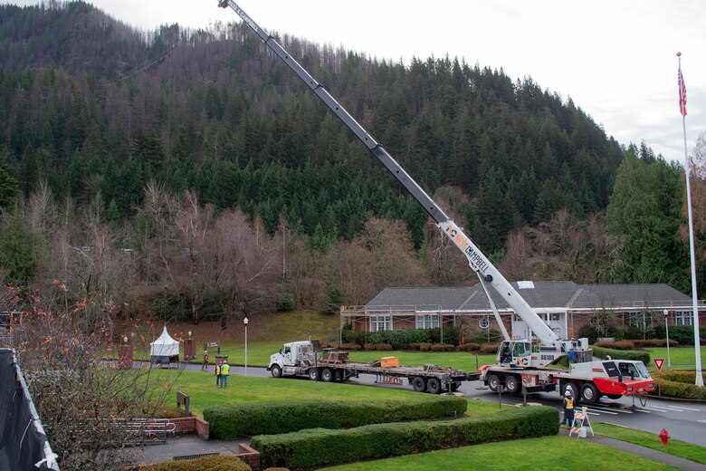 The crane conducts a safety test by lifting the new Auditorium cupola inches off the ground and suspending it for five minutes before placing it on the roof.