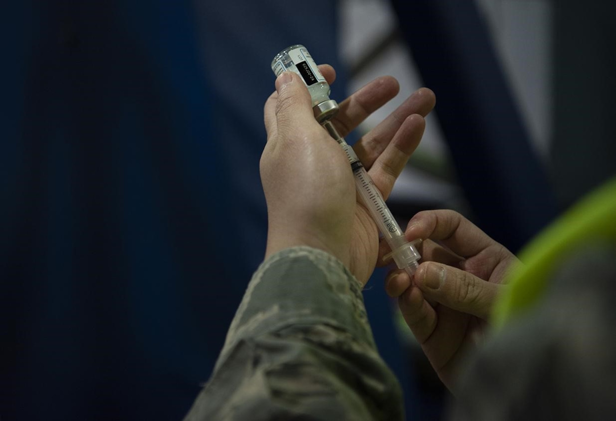 A syringe is prepared with the COVID-19 vaccine at Ramstein Air Base, Germany, Jan. 4, 2021. Health care workers and first responders are the first Airmen eligible to receive the vaccine. The vaccine is administered in two doses, with the second dose given four weeks after the first. (U.S. Air Force photo by Senior Airman Class Jennifer Gonzales)