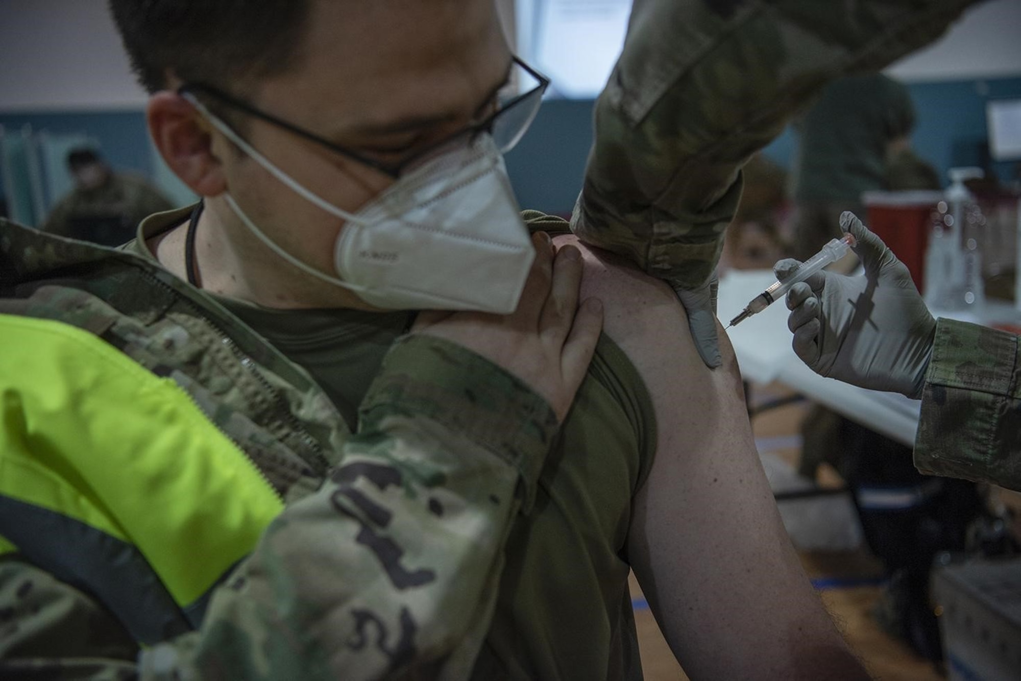 U.S. Air Force Maj. Gregory Baker, 86th Operational Medical Readiness Squadron medical director, receives an initial dose of the COVID-19 vaccine at Ramstein Air Base, Germany, Jan. 4, 2021. Ramstein was one of several overseas military treatment facilities with the capability to receive and distribute the vaccine. (U.S. Air Force photo by Senior Airman Jennifer Gonzales)