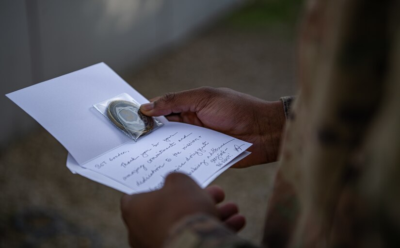 Sgt. Kha'lee Gooden, the National Security Law Paralegal Non-commissioned officer assigned to the 75th Field Artillery Brigade, the “Diamond Brigade”, of Fort Sill, OK, reads a handwritten letter received from Col. Tonya Blackwell, the Staff Judge Advocate for the Fires Center of Excellence and Fort Sill, while he is deployed to the Middle East in support of Operation Spartan Shield and Operation Inherent Resolve, December 15, 2020. Sgt. Gooden has continued to demonstrate outstanding leadership both within and outside of the Diamond Brigade. (U.S. Army photo by Sgt. Dustin D. Biven / 75th Field Artillery Brigade)