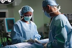 Surgeons perform a procedure at Brooke Army Medical Center, Joint Base San Antonio-Fort Sam Houston, Texas.