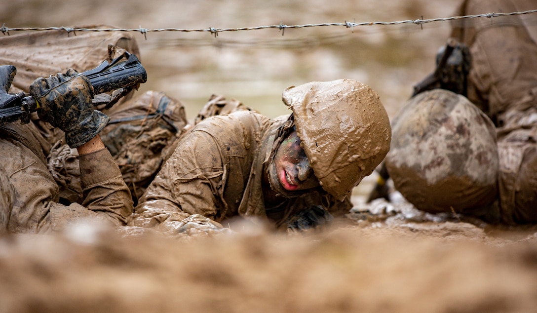 Recruits with November Company, 4th Recruit Training Battalion, work together to move as a fire team through events during the Crucible on Marine Corps Recruit Depot Parris Island, S.C. Dec 3, 2020. The Crucible is recruit training’s 54-hour culminating event that involves food and sleep deprivation and the completion of myriad events for recruits to complete in order to claim the title United States Marine. 



(U.S. Marine Corps photo by Sgt. Dana Beesley)