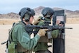 U.S. Marine Corps Lance Cpl. Edgar Wooten (left), basic entryman, and U.S. Marine Corps Sgt. Marcus Edwards (right), team commander, Special Reaction Team, Provost Marshall’s Office, Marine Air Ground Task Force Training Command, practice coordinated movement techniques during an SRT familiarization range at Marine Corps Air Ground Combat Center, Twentynine Palms, California, Dec. 11, 2020. SRT Marines are military police officers trained in hostage situation, active shooter and barricaded suspect response. (U.S. Marine Corps photo by Lance Cpl. Joshua Sechser)