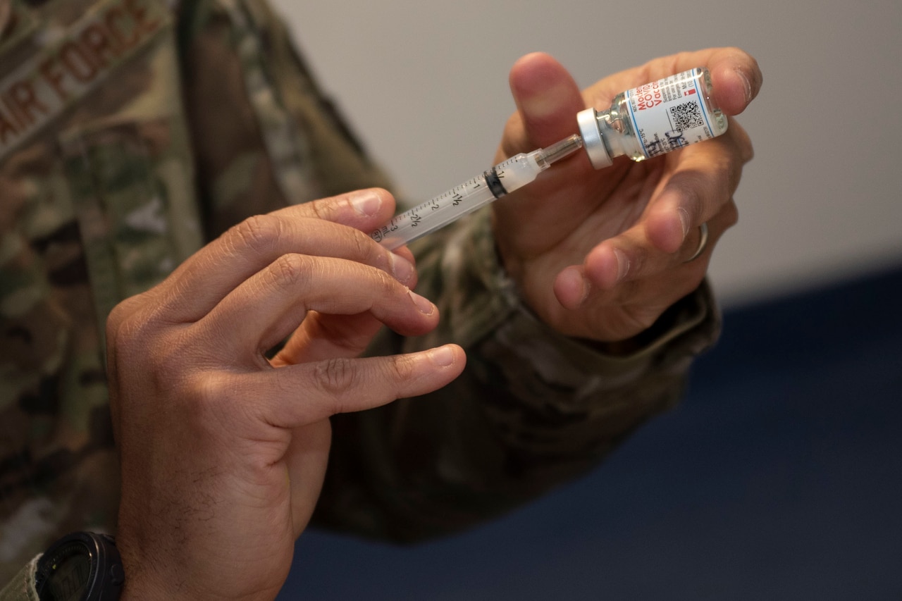 A syringe is filled with a vaccine.