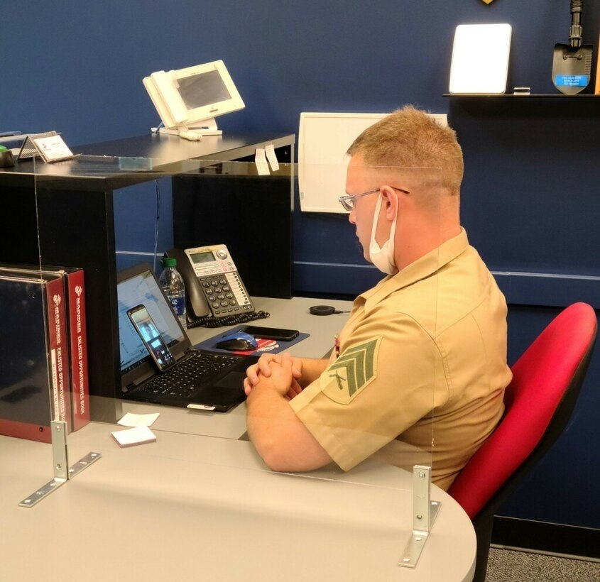 U.S. Marine Corps Sgt. Evan French, a production recruiter, with Recruiting Substation Champaign, Recruiting Station St. Louis conducts a virtual interview with a prospect in Champaign, Illinois on July 28, 2020. During the month of April most of the RSS' stopped area canvasing to look for new prospects to ensure the safety of the recruiters and public. This led them to rely more heavily on phone calls and social media as their tool for communication. (Curtosey Photo)
