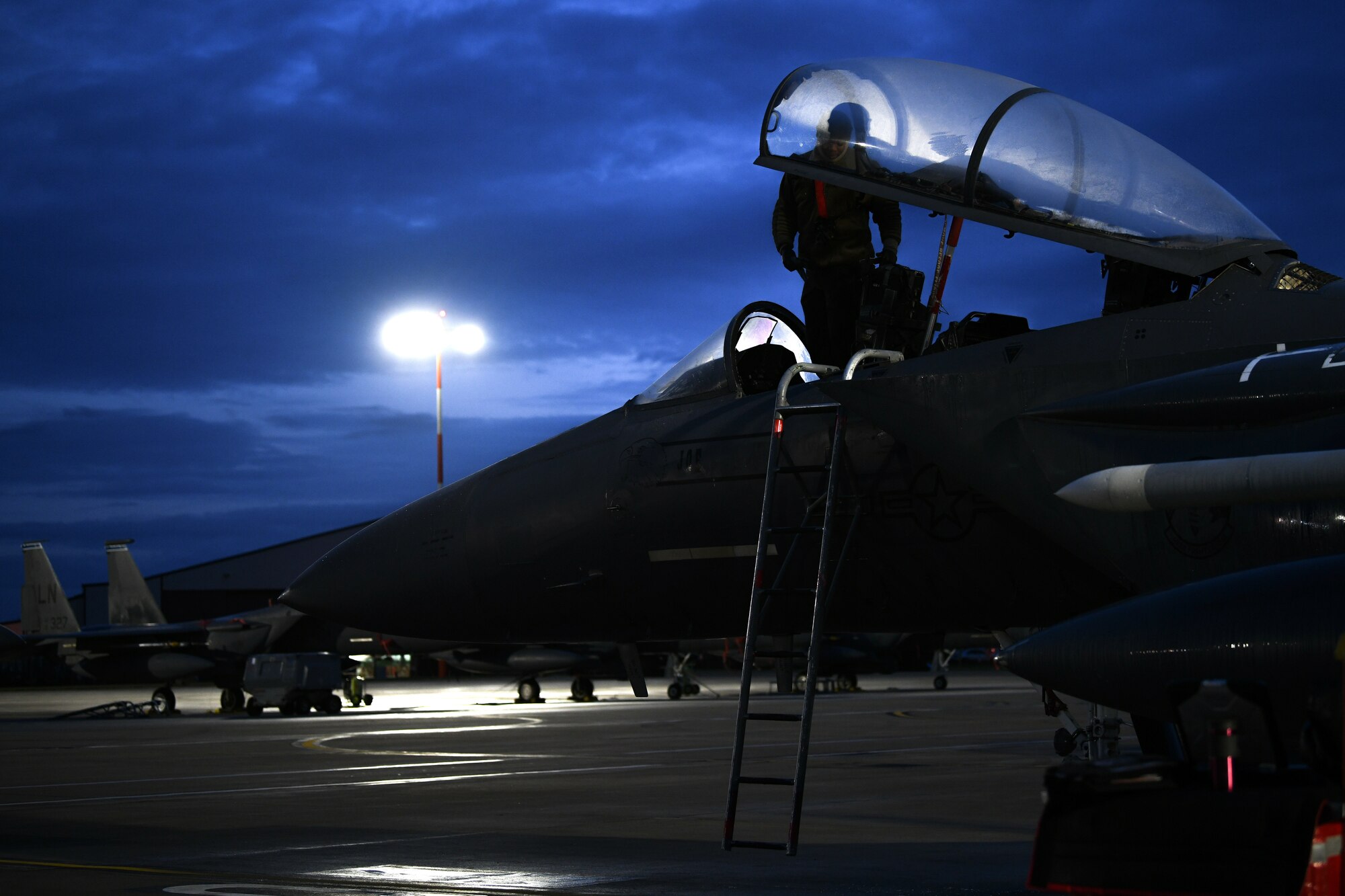 Staff Sgt. Virgil Lawson Jr., 494th Aircraft Maintenance Unit dedicated crew chief, inspects the cockpit of an F-15E Strike Eagle before the first takeoffs of the new year at Royal Air Force Lakenheath, England, Jan. 5, 2021. The 48th Fighter Wing conducts daily flying operations in order to ensure the Liberty Wing can deliver unique air combat capabilities when called upon by its NATO allies. (U.S. Air Force photo by Senior Airman Madeline Herzog)