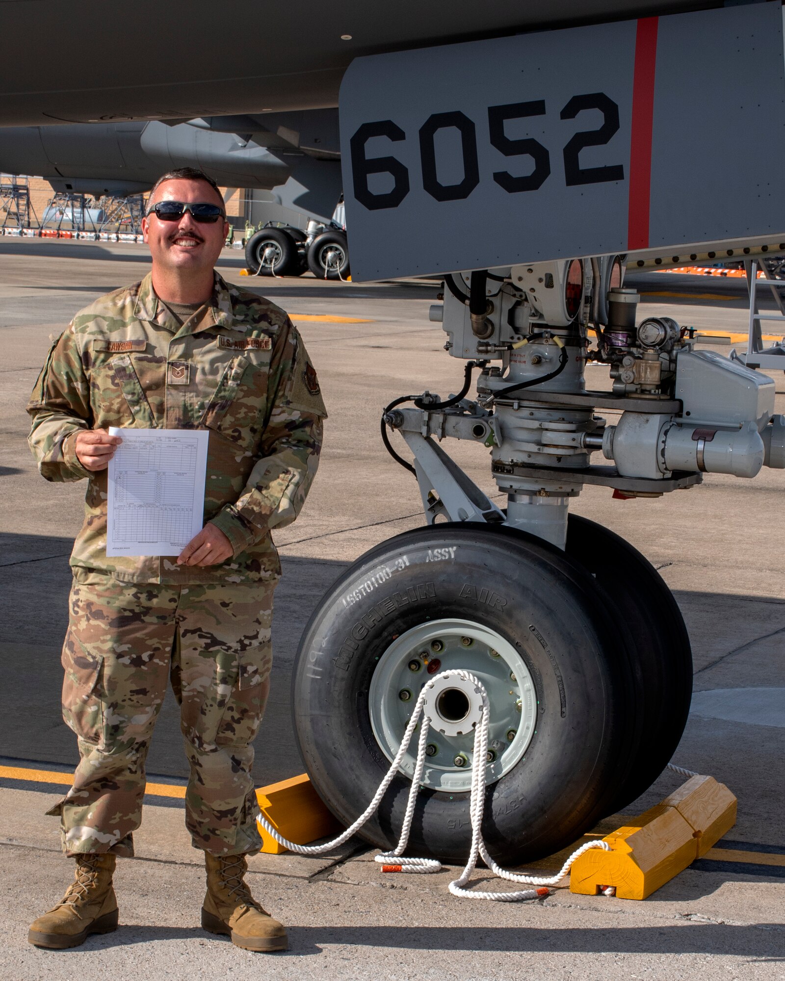 MSgt. Corey Lawson, 916th Aerial Refueling Wing KC-46A Pegasus dedicated crew chief, proudly displays the check list with zero discrepancies listed for tail 6052 on October 22, 2020.