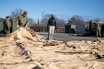 JOINT BASE LANGLEY-EUSTIS, Va. (January 4, 2021) Joint Task Force Civil Support members unfold and inspect a command post tent as part of an equipment check in preparation for the command’s upcoming exercise Sudden Response 21.