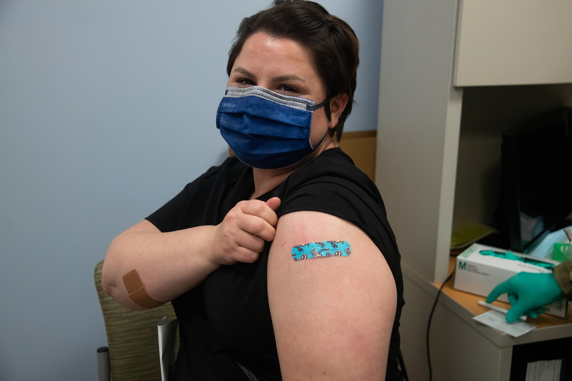 Woman gets COVID-19 vaccine.