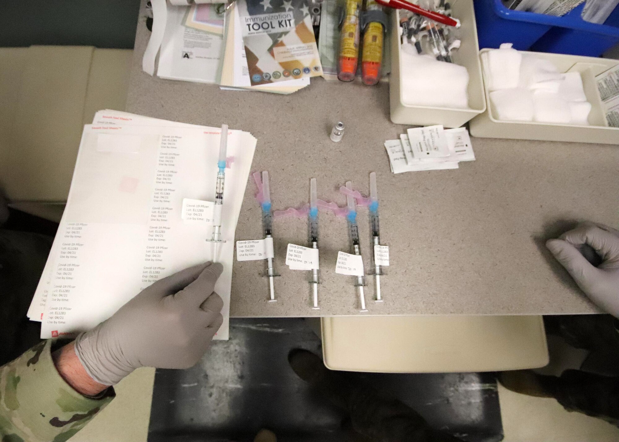 U.S. Airmen with the 673d Medical Group prepare to administer the COVID-19 vaccine at Joint Base Elmendorf-Richardson, Alaska, Dec. 31, 2020. Upon receiving the initial shipment of the vaccine, JBER began inoculating personnel following the Centers for Disease Control and Prevention’s prioritization guidelines. The vaccine is part of Operation Warp Speed, a national initiative to accelerate the development, production and distribution of safe and effective COVID-19 vaccines, therapeutics and diagnostics.