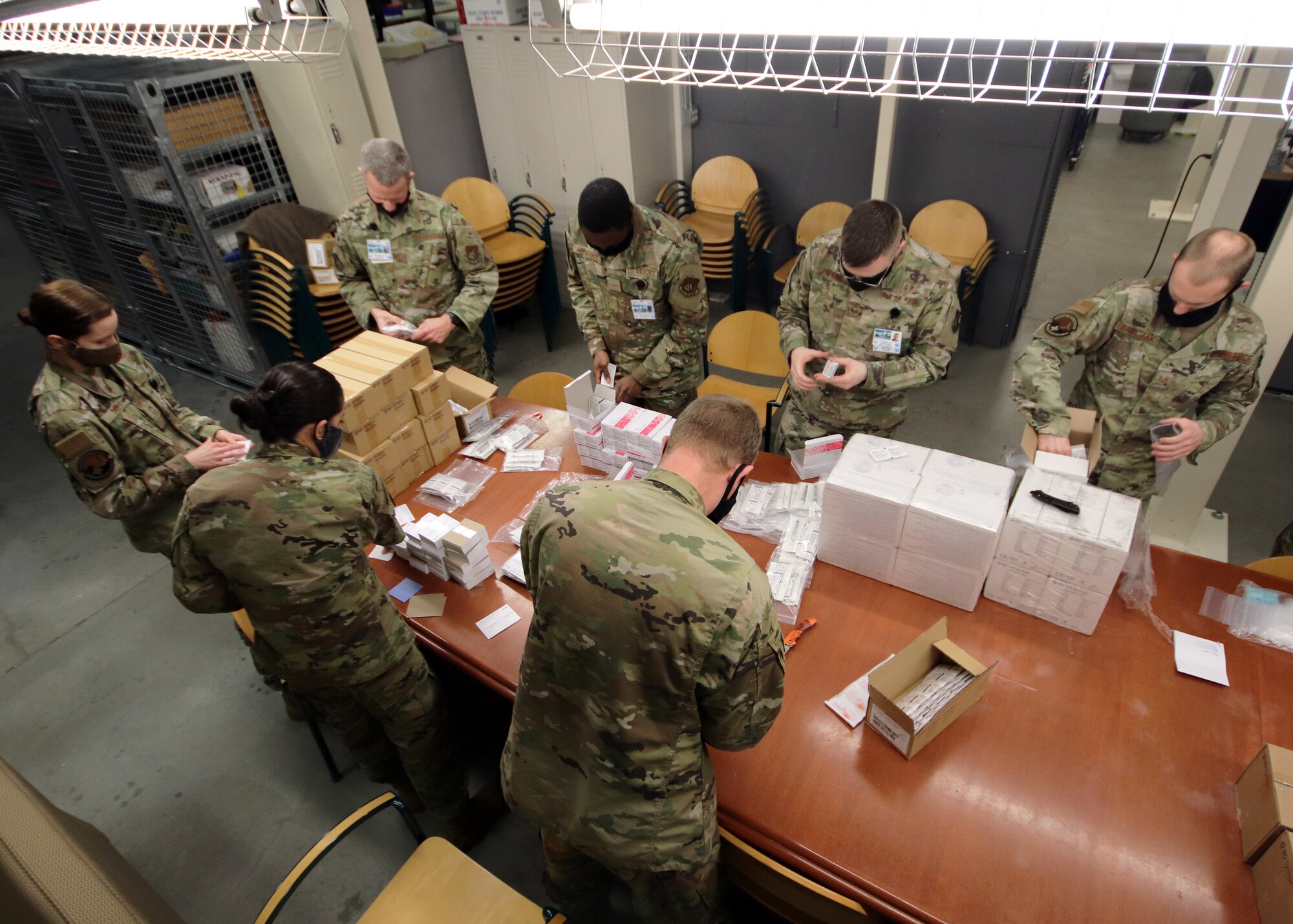 U.S. Airmen with the 673d Medical Group prepare supplies to administer the COVID-19 vaccine at Joint Base Elmendorf-Richardson, Alaska, Dec. 30, 2020. Upon receiving the initial shipment of the vaccine, JBER began inoculating personnel following the Centers for Disease Control and Prevention’s prioritization guidelines. The vaccine is part of Operation Warp Speed, a national initiative to accelerate the development, production and distribution of safe and effective COVID-19 vaccines, therapeutics and diagnostics.