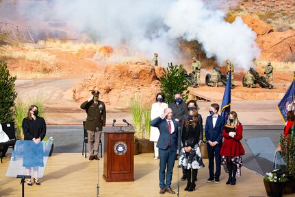 Gov. Spencer J. Cox along with his family stand at attention during a four aircraft flyover by members of 2nd Battalion, 211th General Support Aviation Battalion after Cox took his oath of office at his inauguration ceremony at the Tuacahn Center for the Arts Amphitheatre in Ivins, Utah Jan. 4, 2021.