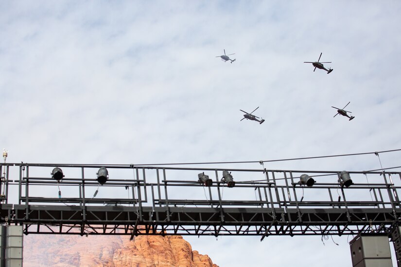 Gov. Spencer J. Cox along with his family stand at attention during a four aircraft flyover by members of 2nd Battalion, 211th General Support Aviation Battalion after Cox took his oath of office at his inauguration ceremony at the Tuacahn Center for the Arts Amphitheatre in Ivins, Utah Jan. 4, 2021