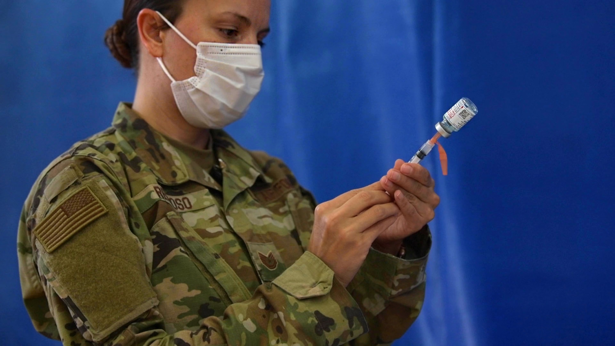 Tech. Sgt. Christina Reynoso, a flight chief from the 18th Healthcare Operations Squadron, fills a syringe with the Moderna COVID-19 vaccine in preparation for the receiving patients, Jan. 4, 2021, at Kadena Air Base, Japan. As part of the DoD strategy for prioritizing, distributing and administering the COVID-19 vaccine, those providing direct medical care and emergency services will be prioritized to receive the vaccine at units based in Japan, including Kadena AB. (U.S. Air Force photo by Airman 1st Class Rebeckah Medeiros)