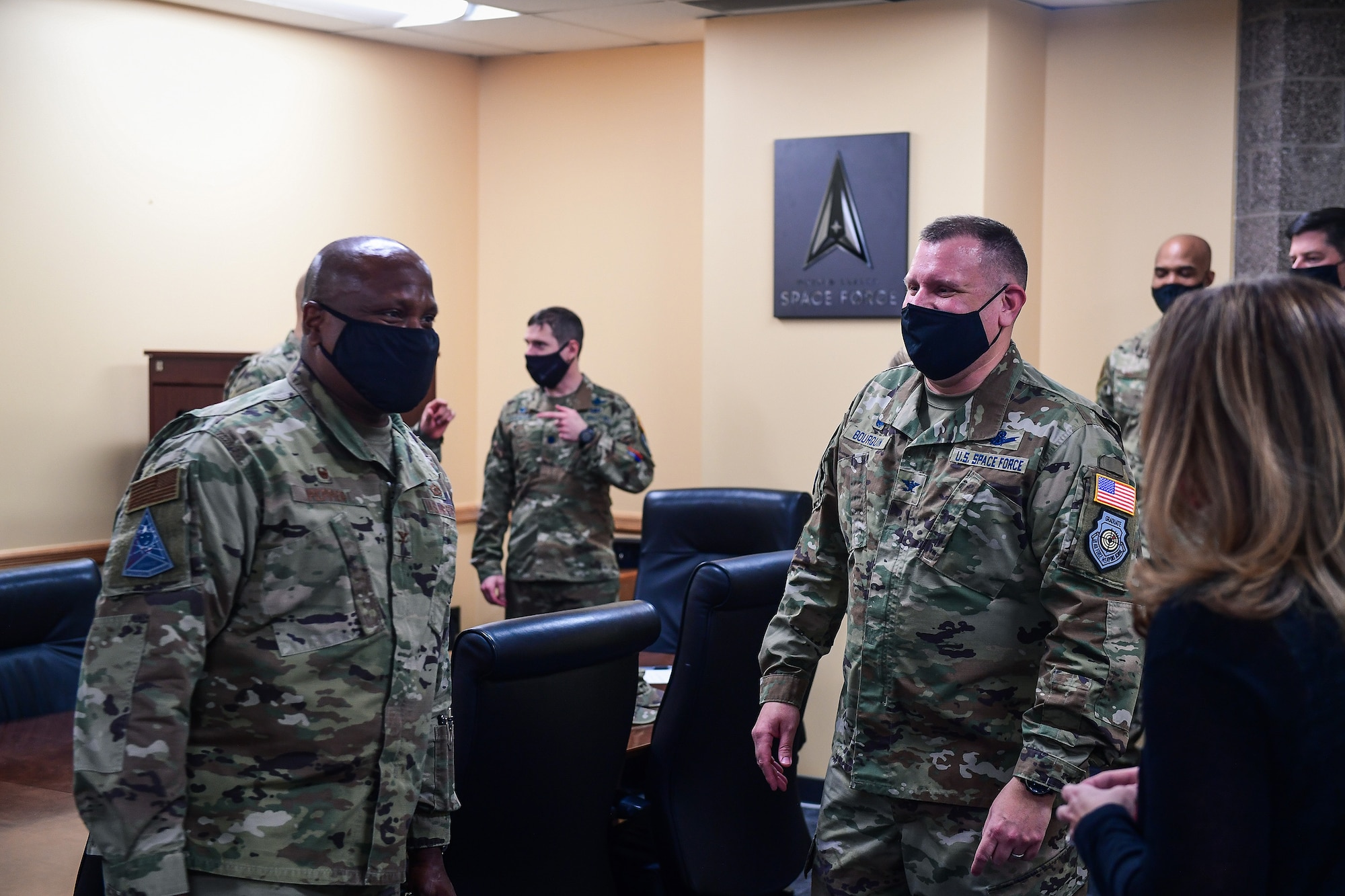 Col. Devin Pepper (left), Buckley Garrison commander, offers his congratulations to Col. Richard Bourquin (right), Space Delta 4 commander, after Bourquin commissioned into the United States Space Force in the DEL 4 conference room at Buckley Air Force Base, Colo., Jan. 5, 2021.