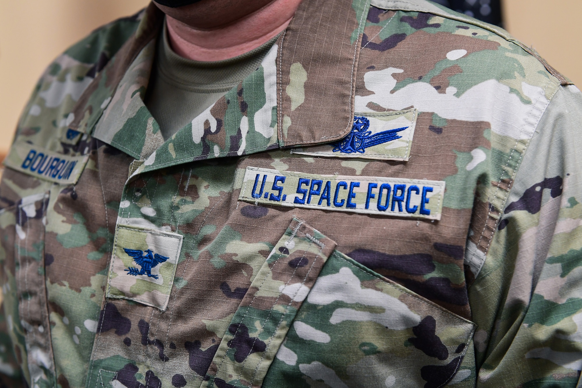 Col. Richard Bourquin, Space Delta 4 commander, poses for a detailed photo of his new U.S. Space Force patches after commissioning into the USSF in the DEL 4 conference room on Buckley Air Force Base, Colo., Jan. 5, 2021.