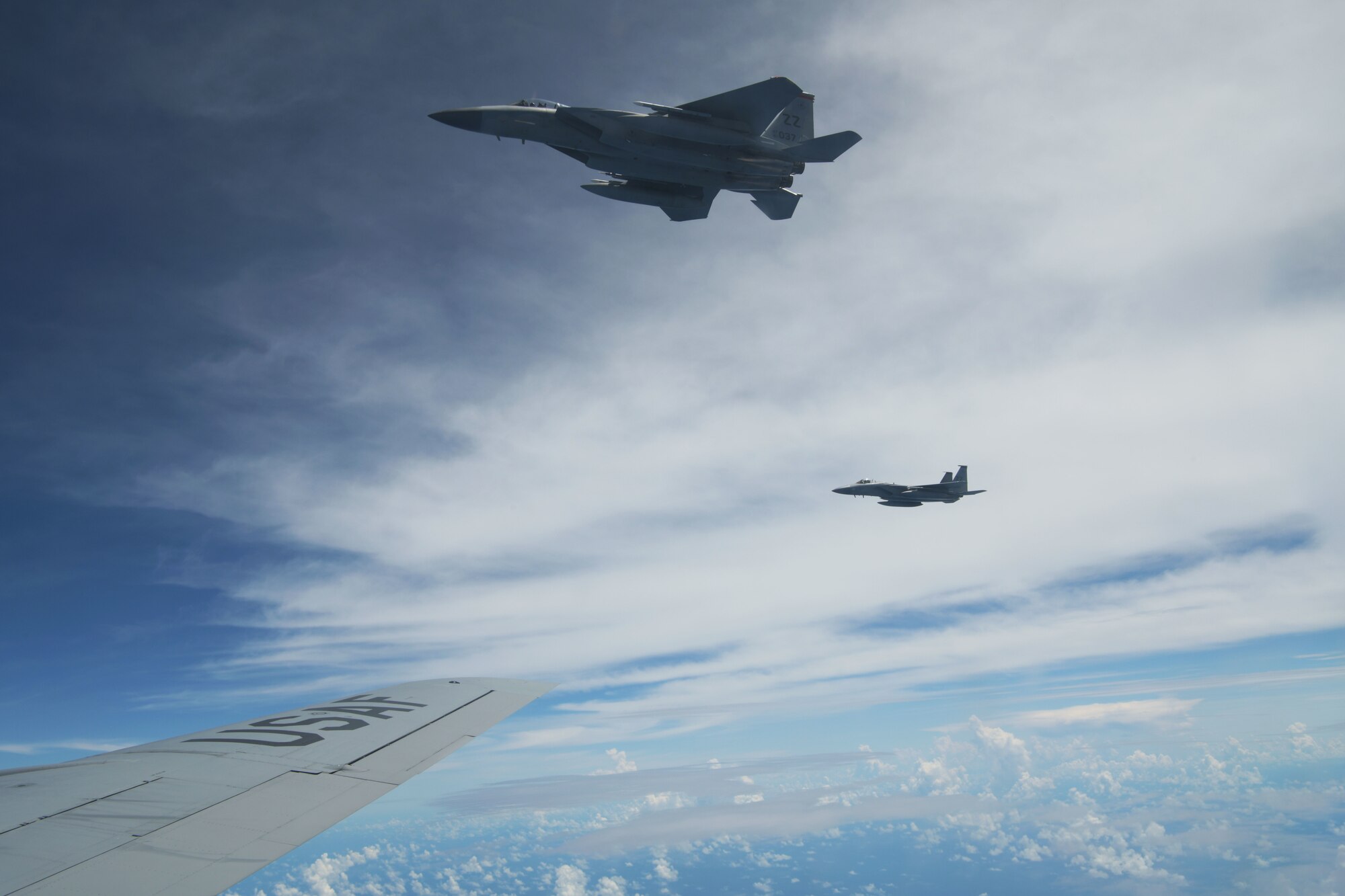 A U.S. Air Force 67th Fighter Squadron F-15C Eagle and a 909th Aerial Refueling Squadron KC-135 Stratotanker prepare to conduct air-to-air refueling during a training exercise July 8, 2020, off the coast of Okinawa, Japan. U.S. Air Forces are postured and ready to respond to crises and contingencies throughout the U.S. Indo-Pacific Command, contributing to regional stability and a free and open Indo-Pacific. (U.S. Air Force photo by Airman 1st Class Rebeckah Medeiros)