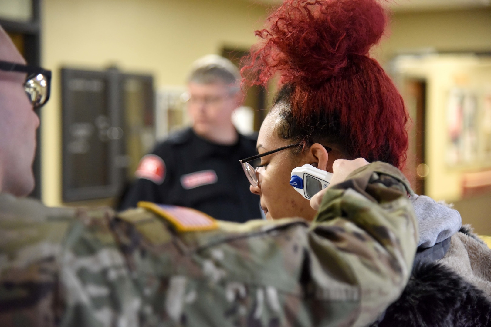 Sgt. James See, 63rd Troop Command, Michigan Army National Guard, ensures proper precautions are followed as employees enter the Grand Rapids Home for Veterans, Grand Rapids, Mich., March 20, 2020.