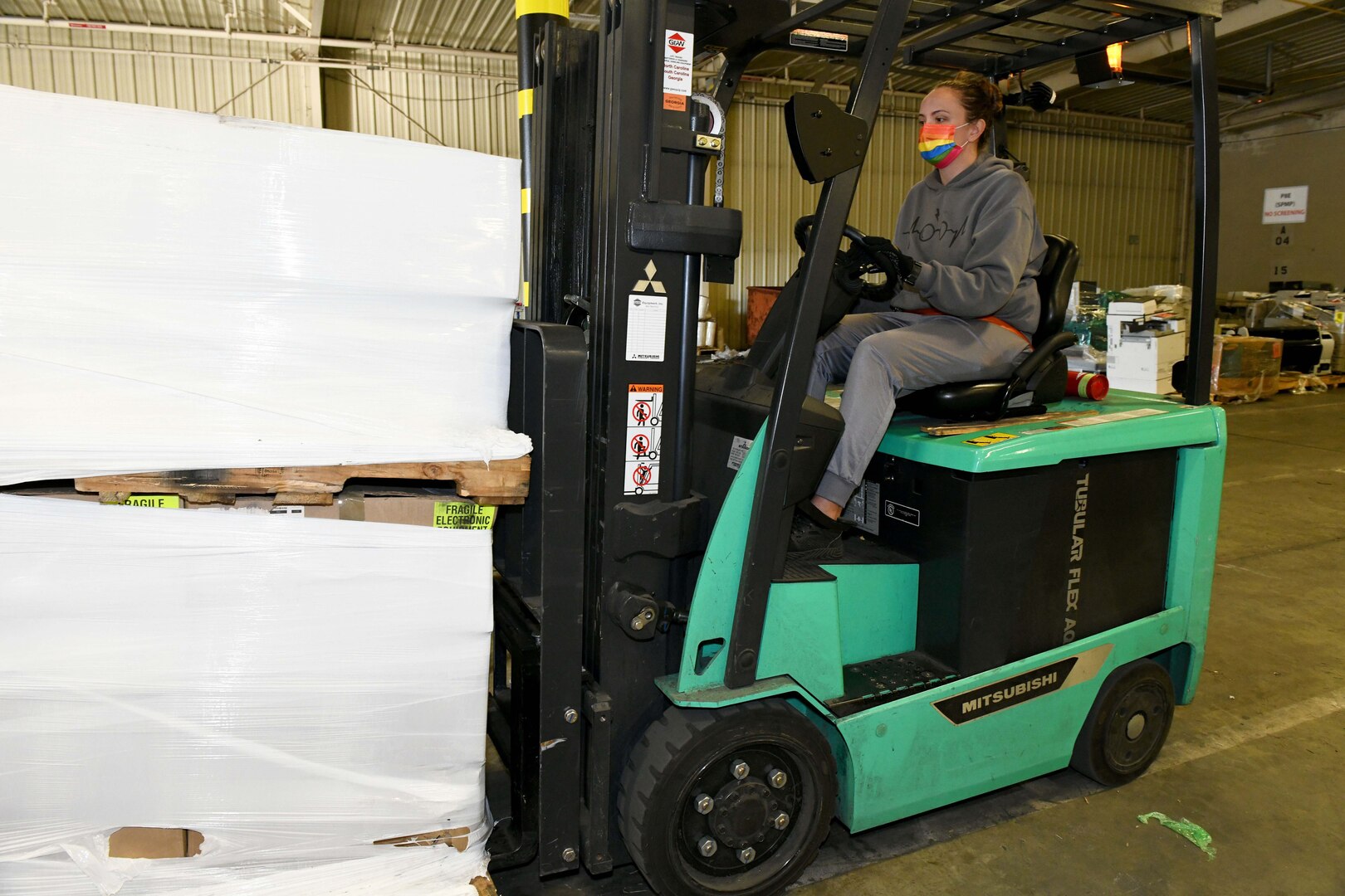 women operating forklift