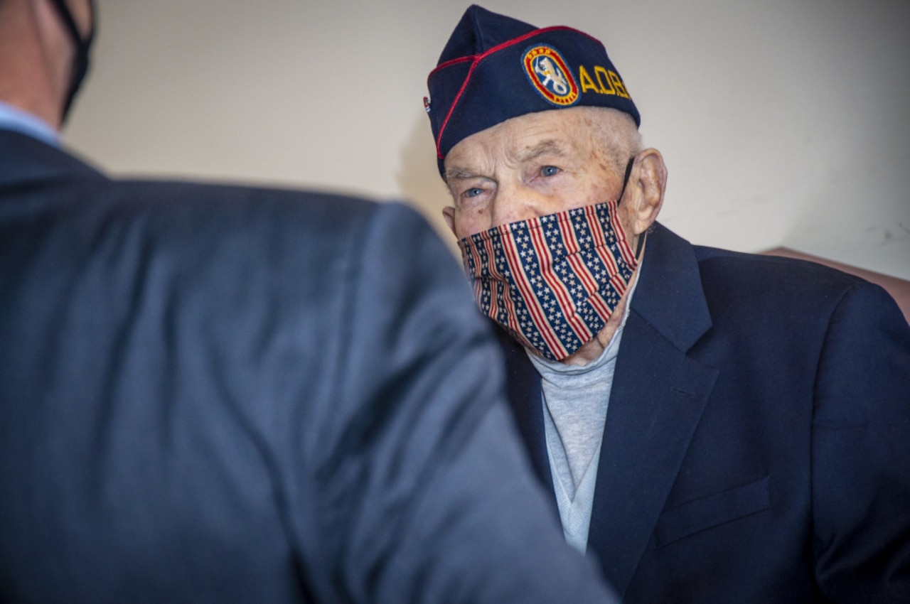 An Army veteran wears a face mask.