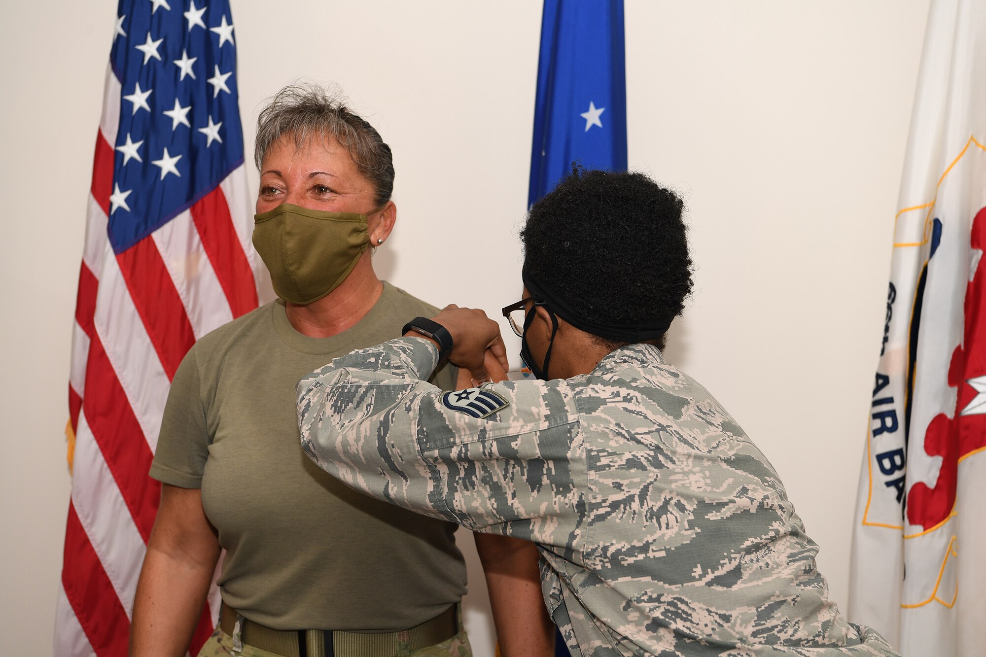 Col. Katrina Stephens, installation commander, receives the influenza vaccine from a 66th Medical Squadron personnel at Hanscom Air Force Base, Mass, late 2020. Officials from the 66 MDS recommend personnel receive a flu shot as soon as possible to protect themselves against illness during the COVID-19 pandemic. (U.S. Air Force photo by Mark Herlihy)