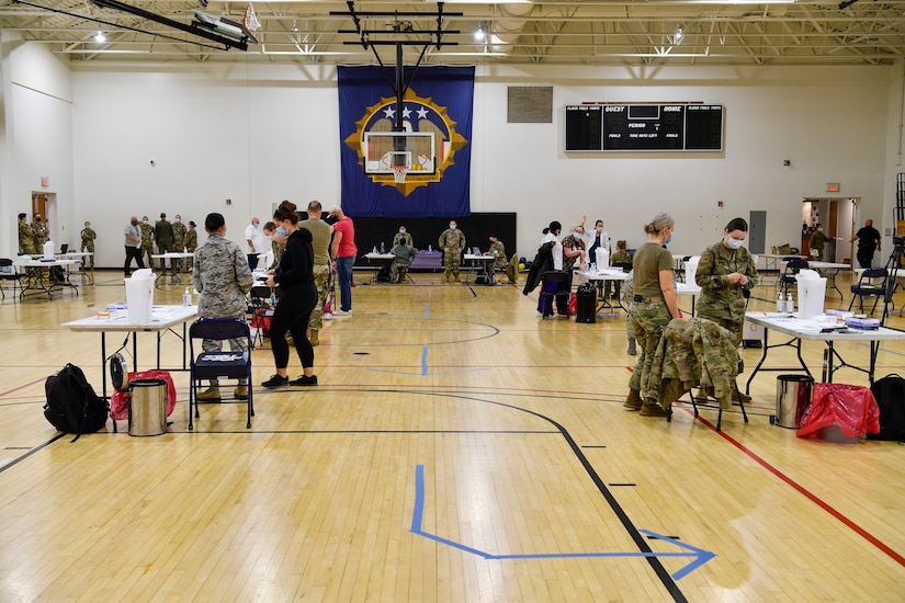 Personnel receive COVID-19 vaccines.