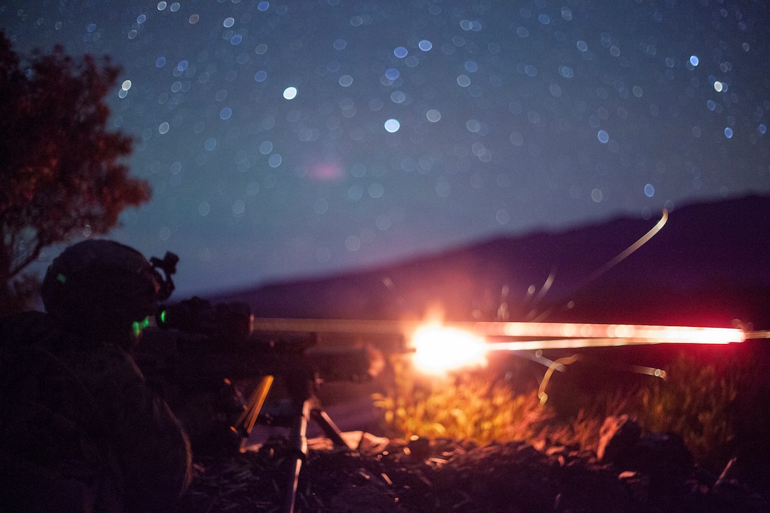 POHAKULOA TRAINING AREA, Hawaii  – U.S. Marine Corps Lance Cpl. Griffin Tuthill, a machine gunner with Charlie Company, Battalion Landing Team 1/4, 15th Marine Expeditionary Unit, fires an M240B machine gun during a live-fire and maneuver training event. The Makin Island Amphibious Ready Group and the 15th MEU are currently conducting routine operations in the U.S. 3rd Fleet area of operations. (U.S. Marine Corps photo by Cpl. Patrick Crosley)