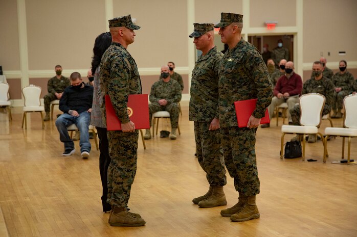 U.S. Marine Corps Sgt. Maj. Charles A. Metzger, left, outgoing sergeant major, Sgt. Maj. Robert M. Tellez, right, incoming sergeant major, and Maj. Gen Julian D. Alford, center, commanding general, all with Marine Corps Installations East-Marine Corps Base Camp Lejeune, participate in a relief and appointment ceremony at Marston Pavilion on MCB Camp Lejeune, North Carolina, Dec. 21, 2020. Metzger, outgoing sergeant major for MCIEAST-MCB Camp Lejeune, relinquished his duties to Tellez and retired after 30 years of honorable service to the Marine Corps. (U.S. Marine Corps photo by Cpl. Ginnie Lee)
