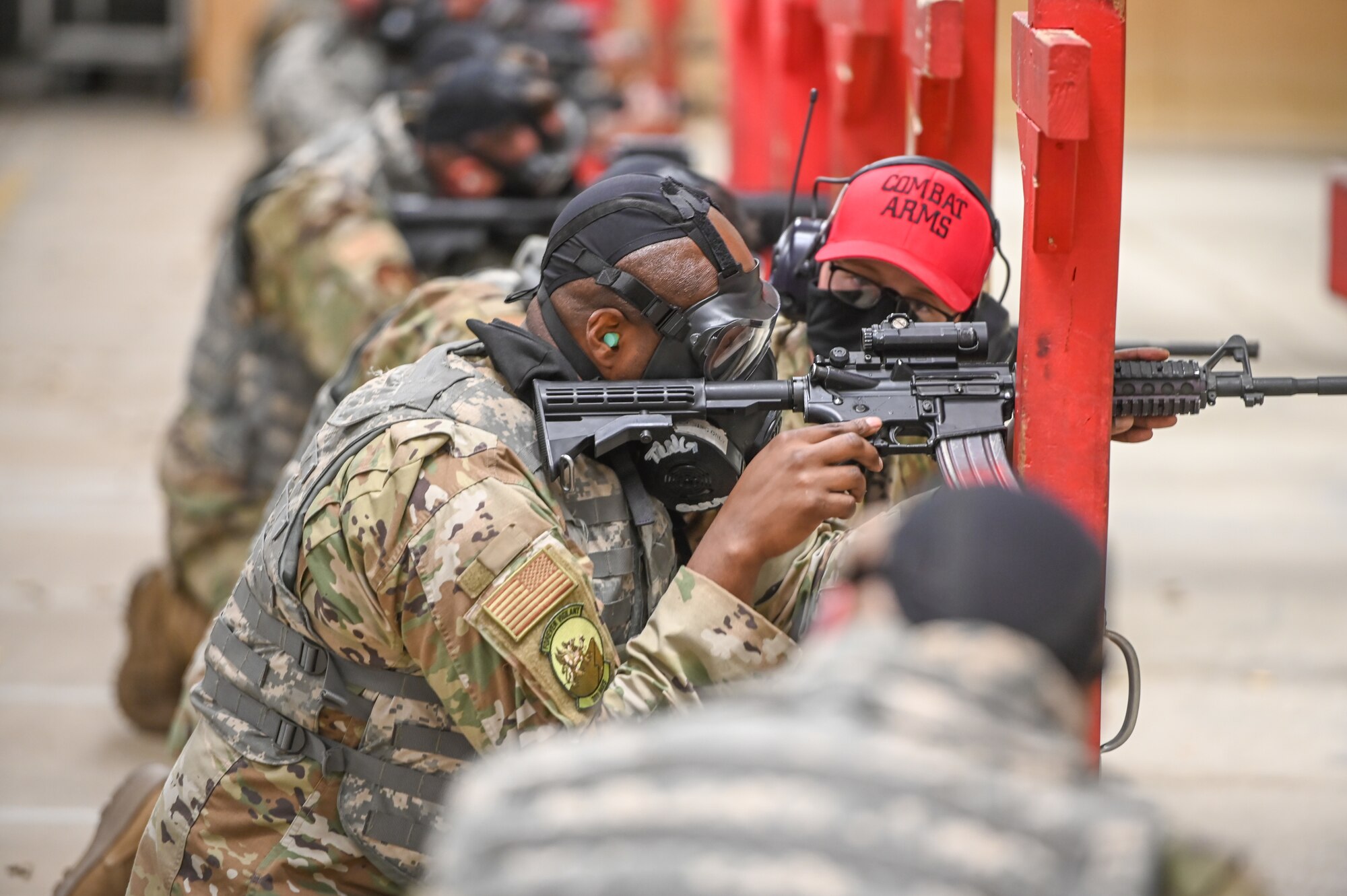 Airman fires rifle.