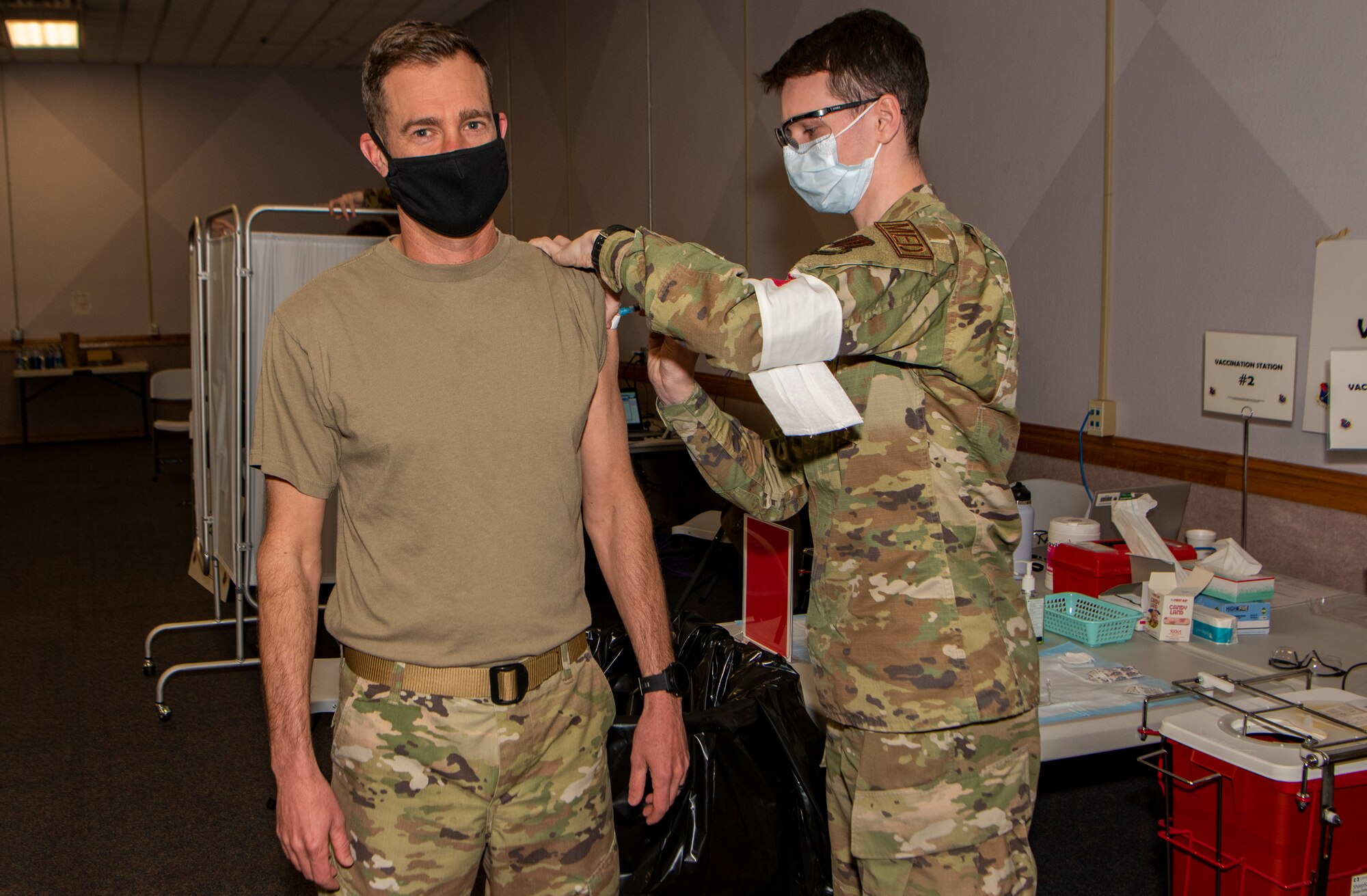 Airman receives a shot in the arm.