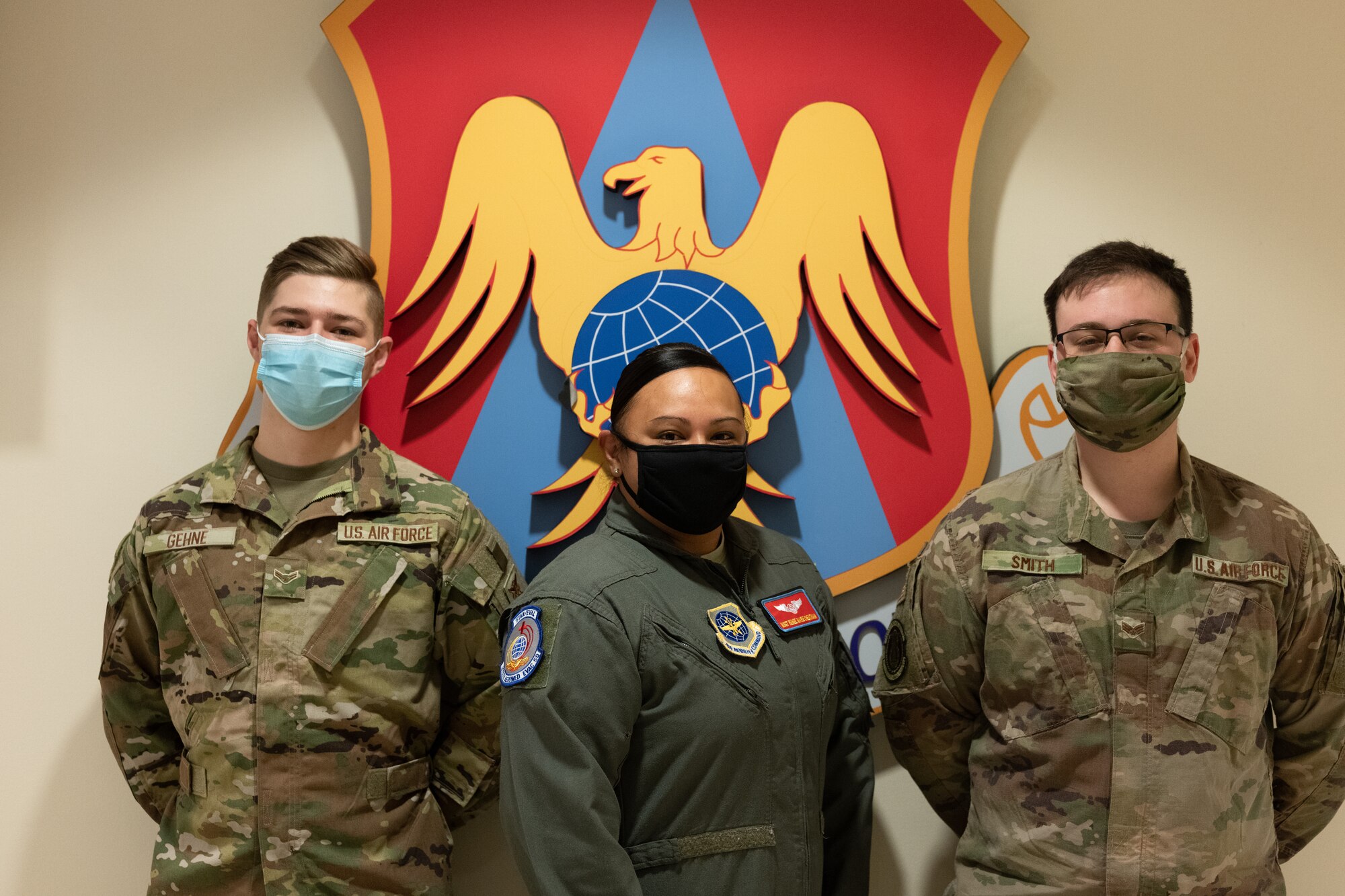 From left: Airman 1st Class James Gehne, 375th Civil Engineer Squadron firefighter, Master Sgt. Renee Cheatham, 375th Aeromedical Evacuation Squadron technician, and Senior Airman Matthew Smith, 375th Security Forces patrolman, are the first three members of Team Scott to receive a COVID-19 inoculation on Scott Air Force Base, Ill., Jan 6, 2021. The Department of Defense prioritizes personnel to receive the vaccines based on Center of Disease Control guidance and the DoD COVID Task Force’s assessment of unique DoD mission requirements. The DoD Prioritization Schema prioritizes those providing direct medical care, maintaining essential national security and installation functions, deploying forces and beneficiaries at the highest risk for developing serious illness before other members of the DoD population. (U.S. Air Force photo by Tech. Sgt. Jordan Castelan)