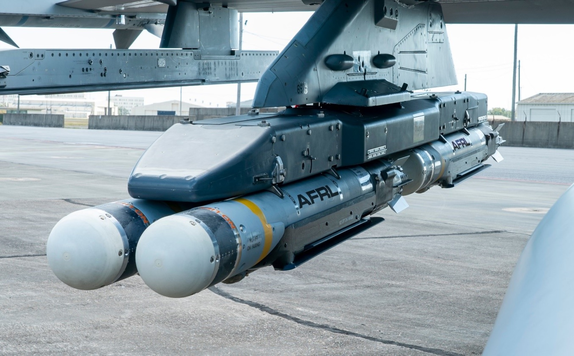 Four Collaborative Small Diameter Bombs (CSDBs) hang from the wing of an F-16 fighter from the Air Force Test Center’s 96th Test Wing at Eglin AFB. Two of the bombs were dropped during the first flight demonstration of the Air Force Golden Horde Vanguard. (Courtesy photo)