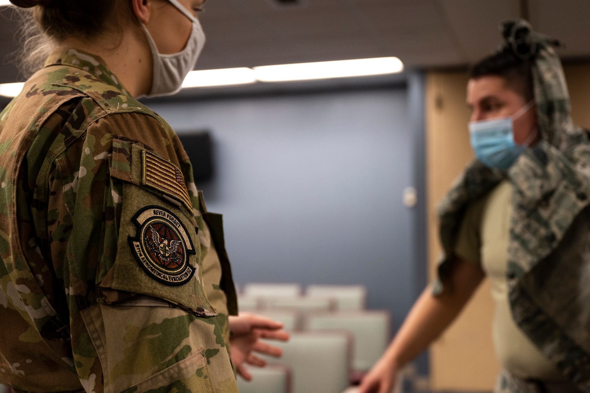 An Airman assigned to the 911th Aeromedical Staging Squadron tries to calm down a simulated patient during an exercise at the Pittsburgh International Airport Air Reserve Station, Pennsylvania, Dec. 9, 2020.