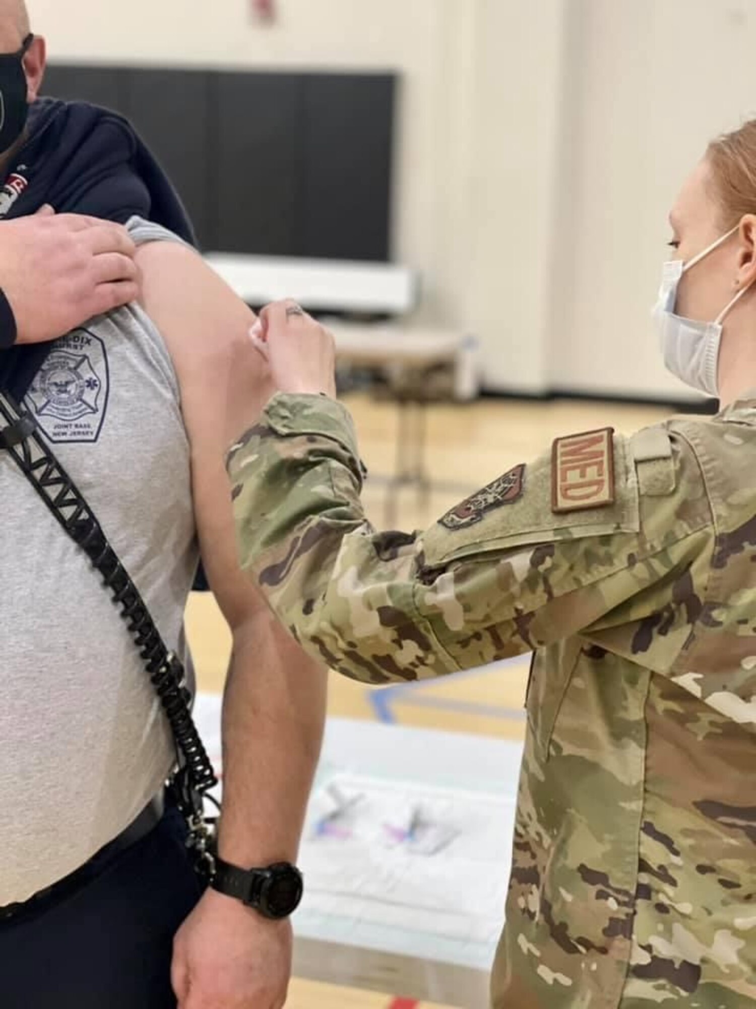A member of the Joint Base McGuire-Dix-Lakehurst community receives the first dose of the COVID-19 vaccine Jan. 6, 2021. Members of the 514th Air Mobility Wing are scheduled to receive the vaccine over the January UTA. (U.S. Air Force photo by Daniel Pensiero)