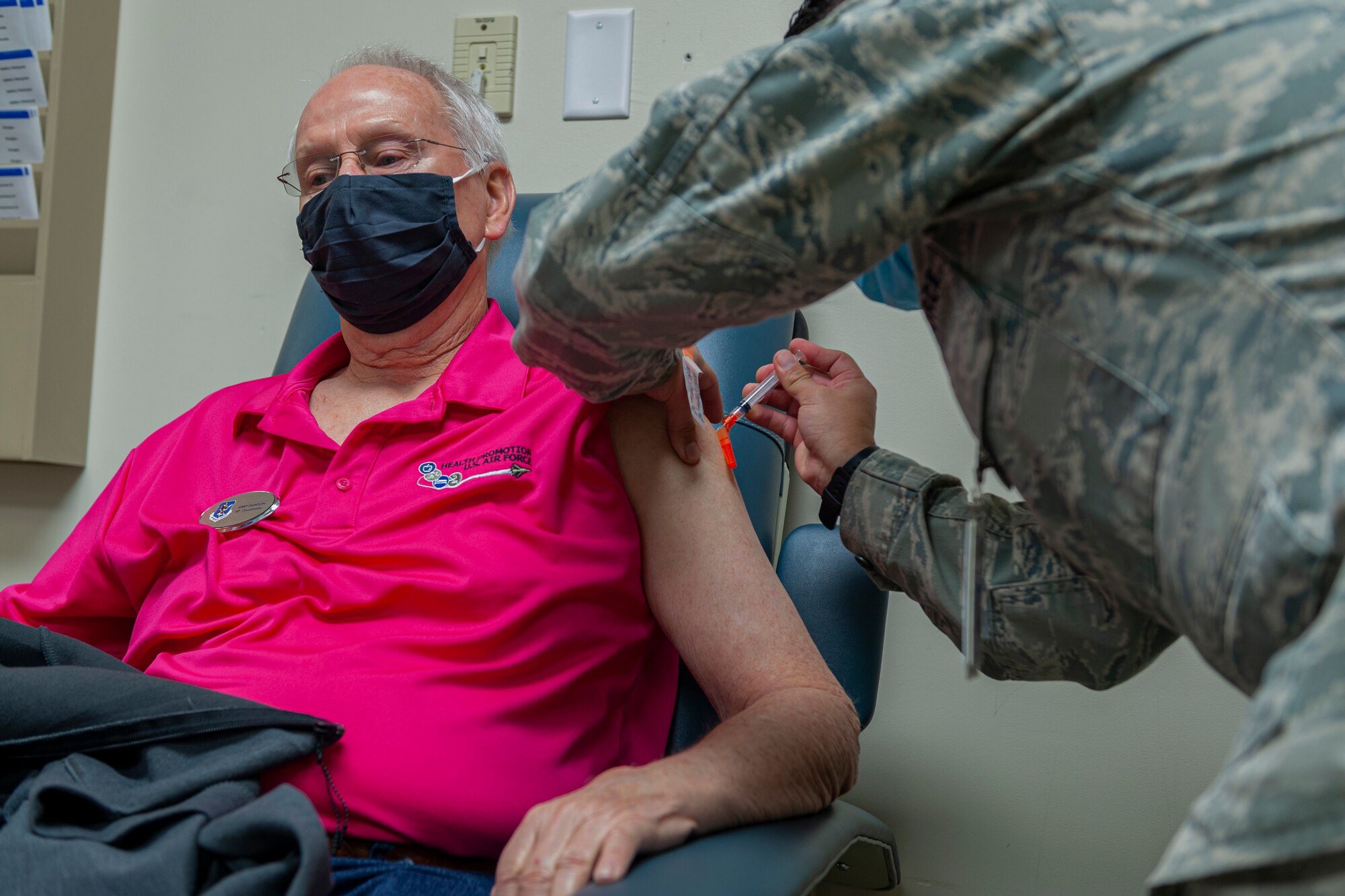Photo of an Airman receiving a vaccine